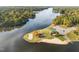Aerial view showcasing lake access with a beach and community park at 104 Chuckwagon Dr, Louisburg, NC 27549