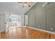 Bedroom with a sunroom and a view of the lake through open french doors at 104 Chuckwagon Dr, Louisburg, NC 27549