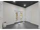 Bonus room with black ceiling, ceiling fan and French doors leading to a deck at 104 Chuckwagon Dr, Louisburg, NC 27549