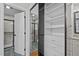 Walk-in closet with built-in shelving and drawers, with a bathroom visible through the doorway at 104 Chuckwagon Dr, Louisburg, NC 27549