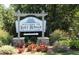 Welcome to Lake Royale sign amid lush landscaping and greenery at 104 Chuckwagon Dr, Louisburg, NC 27549