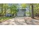 Charming two-story home with a large driveway and a storage shed at 104 Chuckwagon Dr, Louisburg, NC 27549