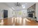 Bright living room with skylights, fireplace, and beautiful wood floors at 104 Chuckwagon Dr, Louisburg, NC 27549