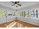 Bright sunroom with multiple windows and lake views at 104 Chuckwagon Dr, Louisburg, NC 27549