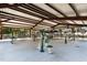 Shaded outdoor fitness area with exercise equipment for residents to stay active and healthy at 104 Chuckwagon Dr, Louisburg, NC 27549