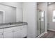 Bright bathroom with granite countertop vanity and glass-enclosed shower at 11470 International Dr, Middlesex, NC 27557
