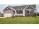 Charming one-story home featuring lush green lawn and appealing curb appeal at 11470 International Dr, Middlesex, NC 27557