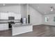 Modern open-concept kitchen featuring stainless steel appliances, granite counters and vinyl flooring at 11470 International Dr, Middlesex, NC 27557