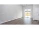 Bright, airy living room features sliding glass doors leading to an outdoor deck and a connecting door at 11470 International Dr, Middlesex, NC 27557