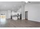 Open-concept living area featuring modern vinyl flooring and high ceilings that create a spacious feel at 11470 International Dr, Middlesex, NC 27557