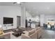 Bright, open living room with vaulted ceilings flows into a modern kitchen and dining area at 11470 International Dr, Middlesex, NC 27557
