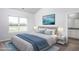Beautiful main bedroom with a large window, plush carpet, and an ensuite bathroom entrance at 11470 International Dr, Middlesex, NC 27557