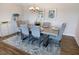 Chic dining room with seating for six, elegant lighting, and stylish decor at 1200 Gathering Park Cir # 302, Cary, NC 27519