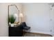 Elegant entryway with a decorative mirror, lamp, and stylish furnishings at 1200 Gathering Park Cir # 302, Cary, NC 27519