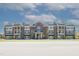 Beautiful brick building with covered parking and nicely manicured landscaping at 1200 Gathering Park Cir # 302, Cary, NC 27519