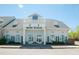 Village Music School building with blue sky and well-maintained landscaping at 1200 Gathering Park Cir # 302, Cary, NC 27519