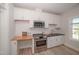 Modern kitchen with stainless appliances, white cabinetry and subway tile backsplash at 1200 Gathering Park Cir # 302, Cary, NC 27519