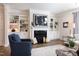 Inviting living room with fireplace, custom built-ins and plenty of natural light at 1200 Gathering Park Cir # 302, Cary, NC 27519