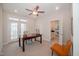 Bright office space with French doors, neutral carpet, and modern ceiling fan fixture at 1200 Gathering Park Cir # 302, Cary, NC 27519