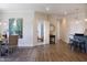 Open-concept living space with dining, kitchen, and a view into another room at 1200 Gathering Park Cir # 302, Cary, NC 27519