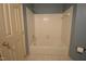 The bathroom features a white tiled shower and decorative wallpaper at 12124 Warwickshire Park, Raleigh, NC 27613