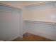 A walk-in closet provides ample storage with shelving and clothing racks at 12124 Warwickshire Park, Raleigh, NC 27613