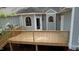 View of the new wooden deck and stairs at 12124 Warwickshire Park, Raleigh, NC 27613