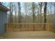 View of the new wooden deck overlooking trees at 12124 Warwickshire Park, Raleigh, NC 27613