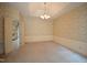 Formal dining room with decorative wallpaper and a chandelier at 12124 Warwickshire Park, Raleigh, NC 27613