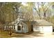Well-maintained home featuring a side-entry garage, bay window, and mature trees at 12124 Warwickshire Park, Raleigh, NC 27613
