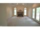 Bright living room with a vaulted ceiling, a brick fireplace, and a view to the outside deck at 12124 Warwickshire Park, Raleigh, NC 27613