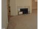 Cozy living room with a fireplace and neutral carpet at 12124 Warwickshire Park, Raleigh, NC 27613