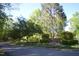 Community sign surrounded by flowerbed and bushes at 12124 Warwickshire Park, Raleigh, NC 27613