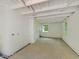 Basement with white painted walls, concrete flooring and a large window for great natural lighting at 1243 Nc 231, Wendell, NC 27591