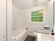 Clean, bright bathroom with a shower and tub, modern fixtures and great natural lighting at 1243 Nc 231, Wendell, NC 27591