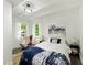 Inviting bedroom with large windows, and rustic rocking chair at 1243 Nc 231, Wendell, NC 27591