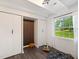 Bright bedroom with hardwood floors, white walls, and a large window for natural light at 1243 Nc 231, Wendell, NC 27591