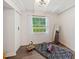 Bright bedroom with hardwood floors, white walls, and a large window for natural light at 1243 Nc 231, Wendell, NC 27591