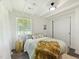 A sunlit bedroom with neutral color scheme and sliding closet doors at 1243 Nc 231, Wendell, NC 27591