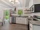 Modern kitchen with stainless steel appliances, granite countertops, and sliding door to backyard at 1243 Nc 231, Wendell, NC 27591