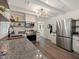 Modern kitchen with stainless steel appliances, granite countertops, and bright lighting at 1243 Nc 231, Wendell, NC 27591