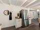 Kitchen area featuring stainless steel refrigerator and granite counters and flooring at 1243 Nc 231, Wendell, NC 27591