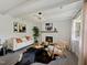 Bright living room features modern lighting, comfortable seating, and hardwood flooring at 1243 Nc 231, Wendell, NC 27591