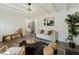 Cozy living room with neutral color palette, a modern chandelier, and a fireplace at 1243 Nc 231, Wendell, NC 27591