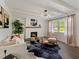 Inviting living room boasts a charming fireplace, stylish decor, and abundant natural light at 1243 Nc 231, Wendell, NC 27591