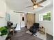 Well-lit home office featuring stylish decor, ample workspace, and barn door to laundry room at 1243 Nc 231, Wendell, NC 27591