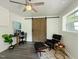 Stylish home office with wood accents, modern furniture and a ceiling fan at 1243 Nc 231, Wendell, NC 27591