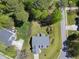 Aerial view displaying a house with nice landscaping and outdoor living space in a residential neighborhood at 129 Camille Cir, Youngsville, NC 27596