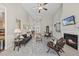 Open-concept living room featuring a fireplace, high ceilings, neutral walls, and view into the entry way at 129 Camille Cir, Youngsville, NC 27596