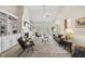 Spacious living room featuring a fireplace, built-in shelving, and large windows with bright natural light at 129 Camille Cir, Youngsville, NC 27596
